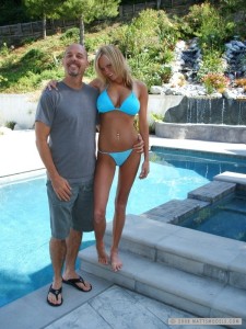 Matt Frackas and Hanna Hilton by a pool